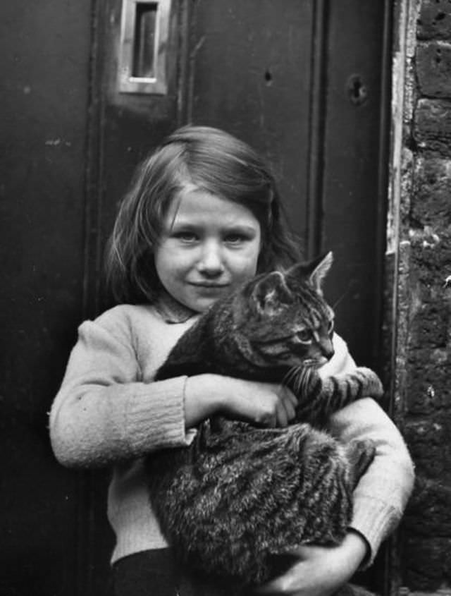 #33 A Little Girl With Her Cat