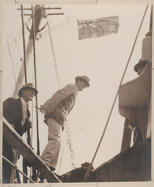 #37 Madigan at the rail and Mawson stepping from the rail of the Aurora, 1911-1914