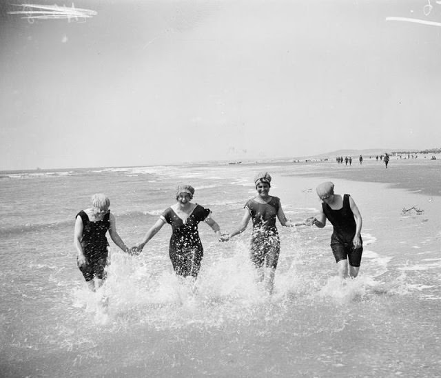 #15 4 Women enjoying at beach with differnt bathing suits, 1912