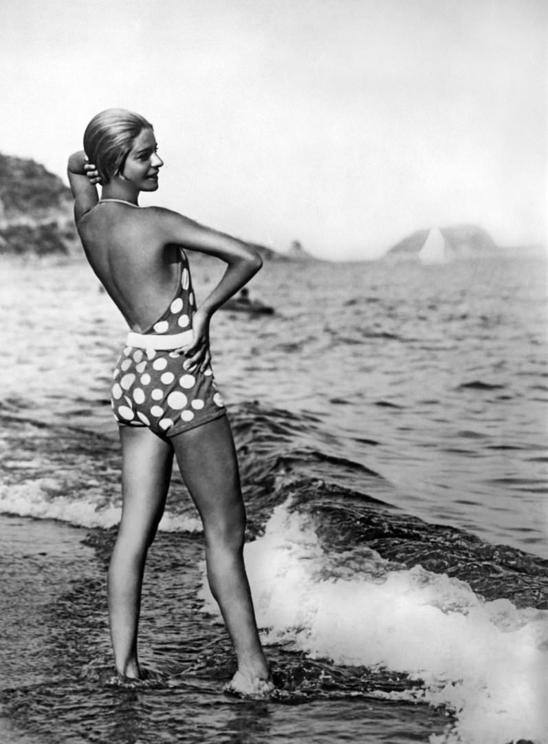 #24 Dancer Alice Nikitina wearing a striking bathing suit at the beach in Alassio, Italy, 1929