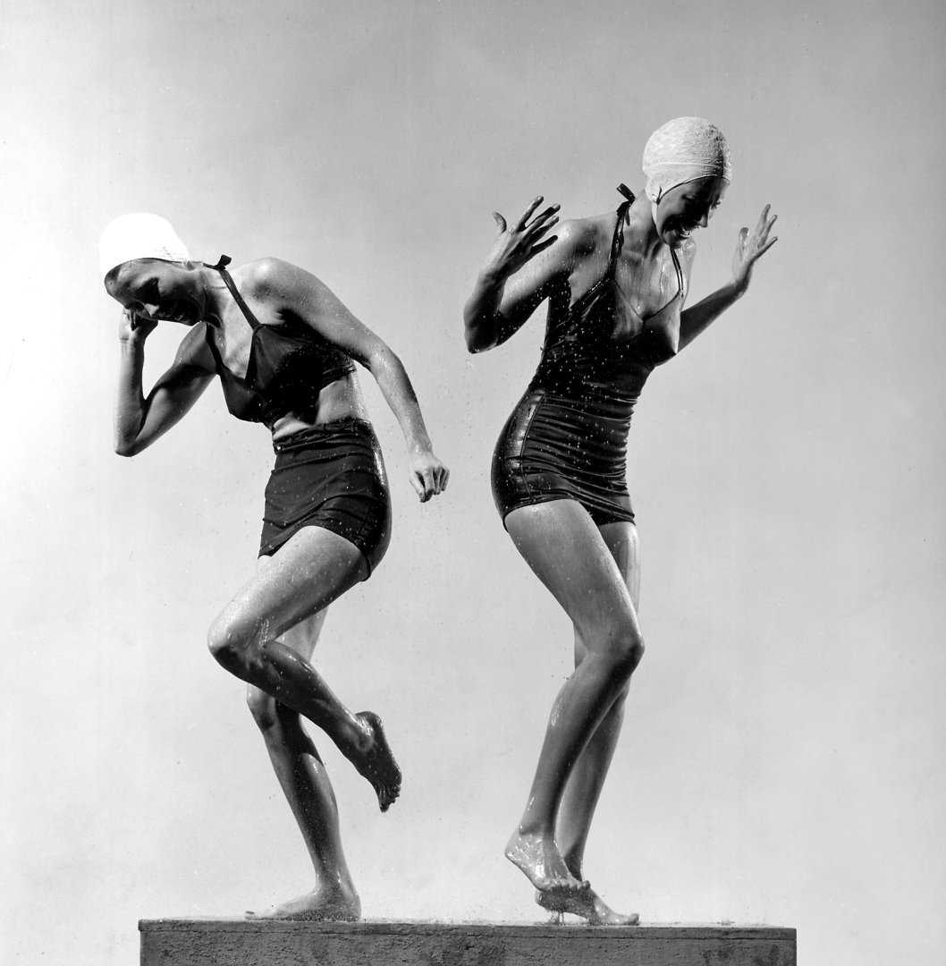 #47 Two models wearing bathing suits and bathing caps,1946