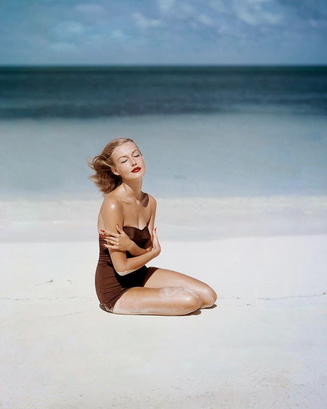 #54 Liz Pringle as Liz Benn models a strapless swimsuit by Givenchy Vogue, 1953