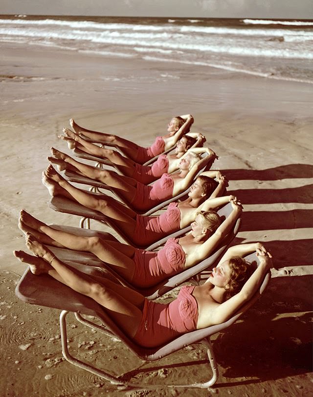 #55 A group of southern belle models sunbathe on the beach at Cypress Gardens theme park, Winterhaven, Florida, 1953