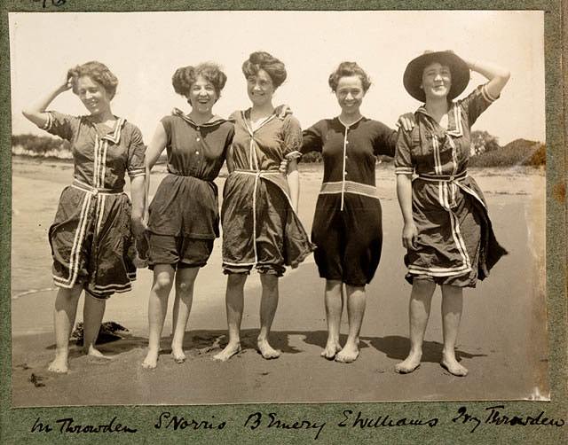 #7 Women wearing 1900s swimsuits having right down to the collars and buttons made from heavy flannel or wool fabrics
