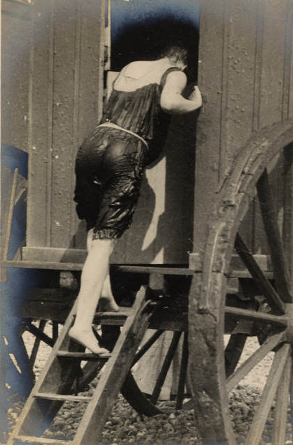 #9 Edwardian woman enters a bathing machine after a swim, 1906