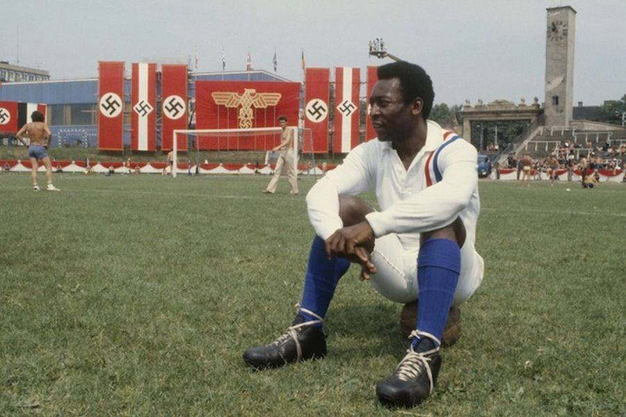 Pelé takes a break during the filming of “Escape to Victory”, 1981