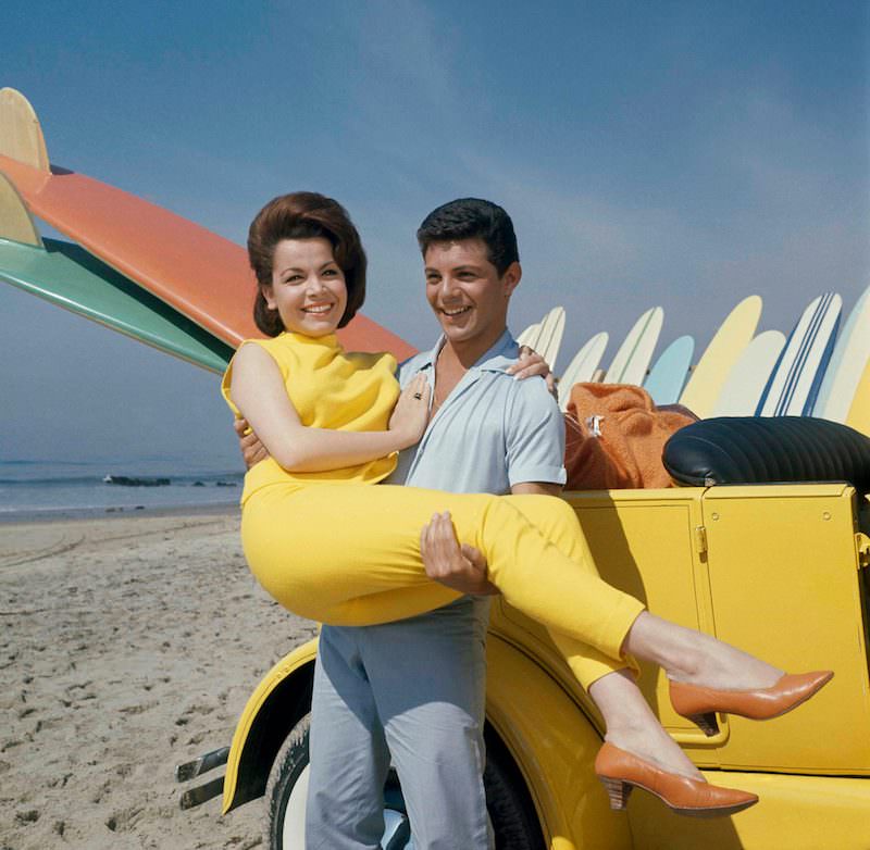 Actress Annette Funicello and singer Frankie Avalo on beach during filming of “beach Party”, 1963