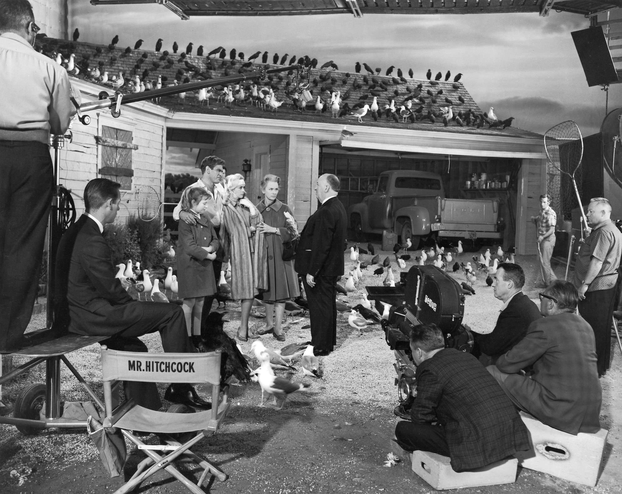 Director Alfred Hitchcock on set during the filming of “The Birds”, 1962