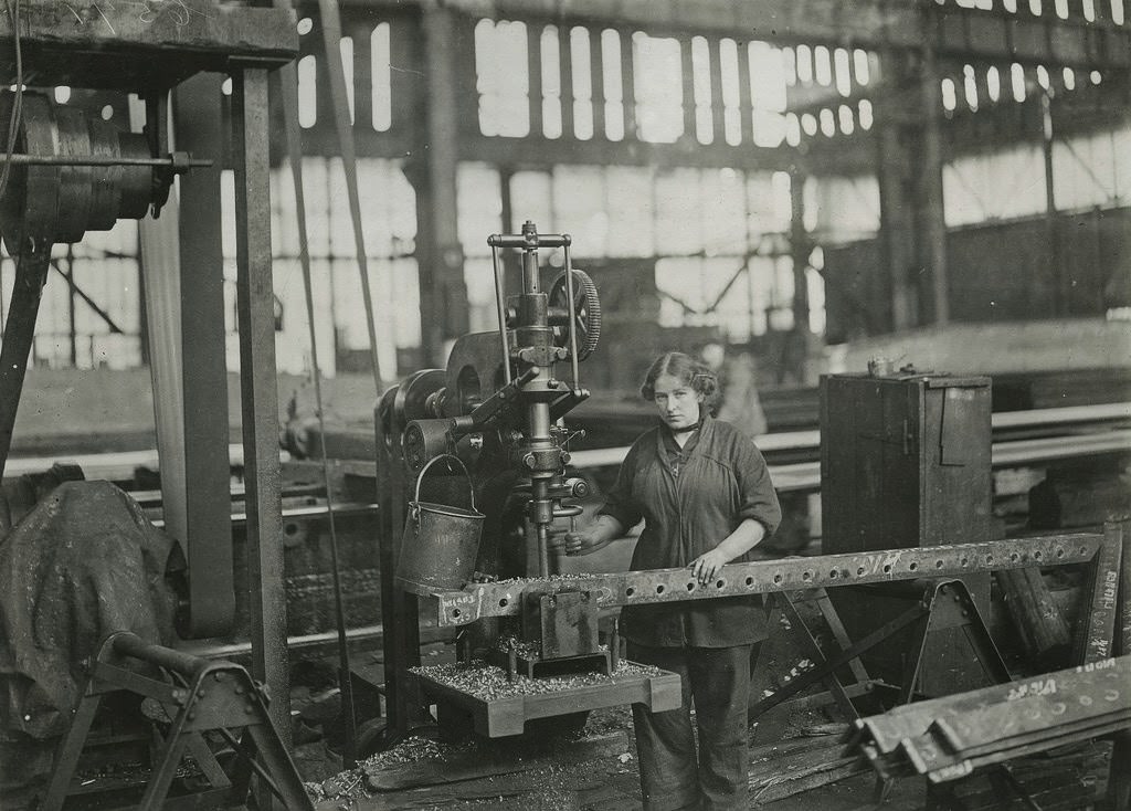 #46 Woman operating vertical drilling machines, drilling angles for connections to ribs of airship sheds