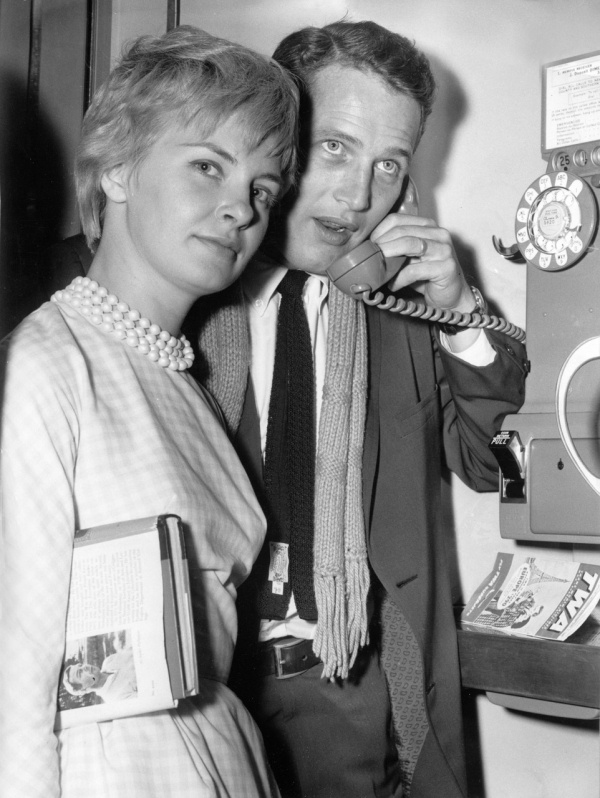 #2 Paul Newman on the phone standing with Joanne Woodward, 1960