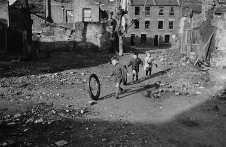 Children play in a bomb-damaged area of London, 1946.
