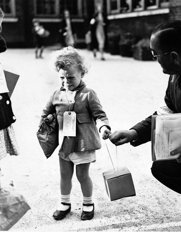A young child named Freddie Somer cries upon arriving at King’s Cross Station in London for wartime relocation. 1939.