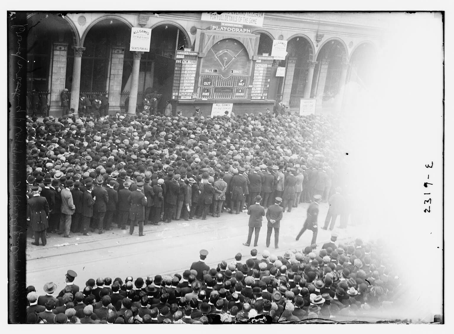 Fans following a 1911 World Series game on a “playograph” in NYC