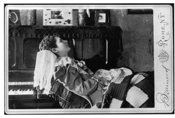 Cabinet card of a deceased young woman in her parlor by a Rome, NY photography studio, 1890’s.