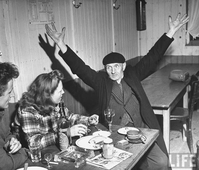 #20 Ernest Kreiling and his bride talking with elderly Frenchman.
