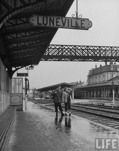 #15 Ernest Kreiling walking on platform of train station with his bride.