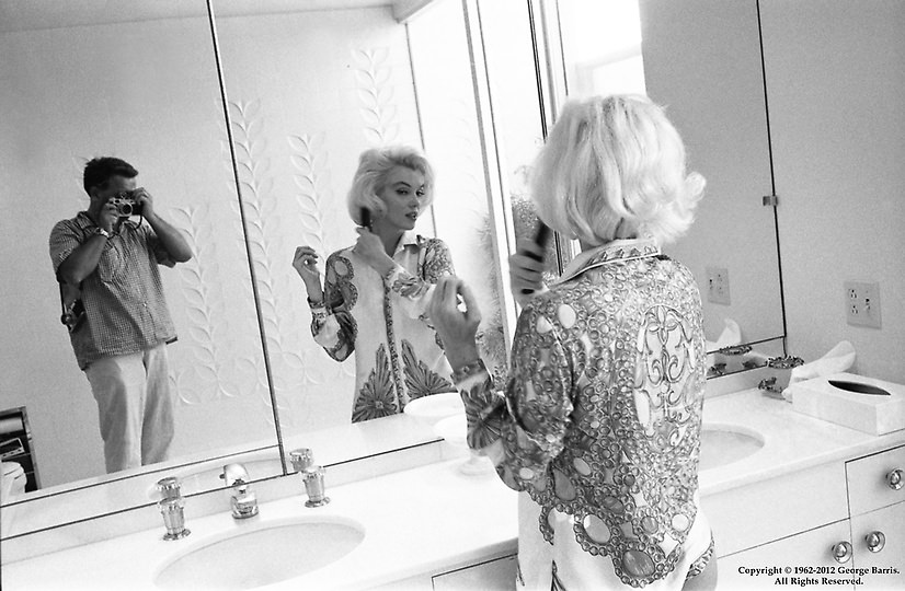 #25 Marilyn Monroe posing for photograph