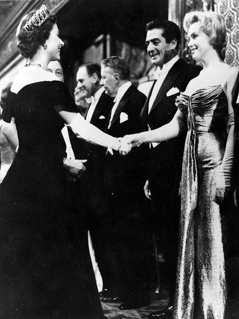 #62 Marilyn Monroe and Queen Elizabeth meet at a movie premier in London, 1956