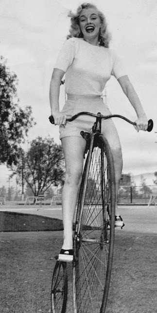 #27 Marilyn Monroe on a penny-farthing bike in 1949