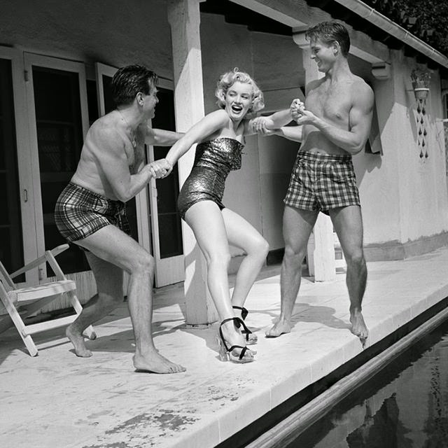 #30 Marilyn jokes around with two male friends in Los Angeles, 1950