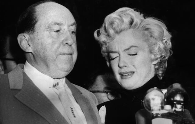 #53 Marilyn Monroe crying during media gathering outside her home after Joe DiMaggio packed his bags and moved out, 1954