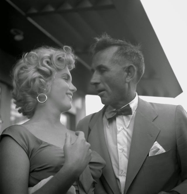 #43 Marilyn with photographer Earl Theisen at a party celebrating Ray Anthony’s song “Marilyn.”, 1952