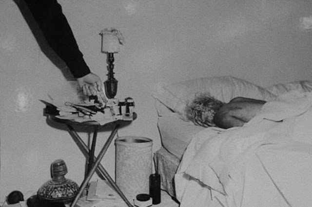 #65 The lifeless body of Marilyn Monroe, in the bedroom in which she was found dead on August 6, 1962