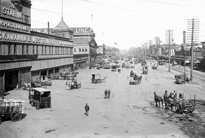 #63 A view of bustling port area on West Street, 1899