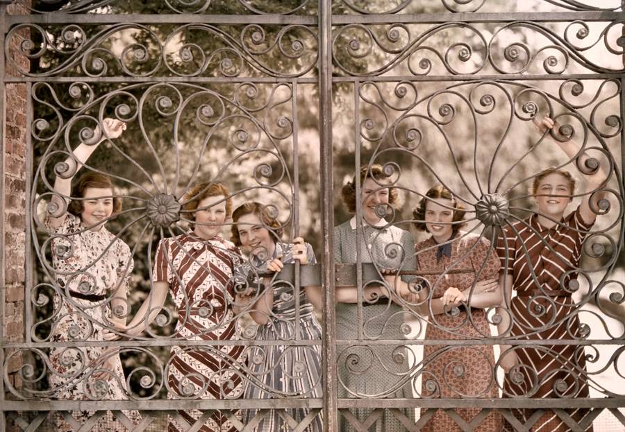 #12 Students from five states smile through the gate of Ashley Hall in Charleston, South Carolina, 1939