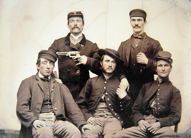 #8 Unidentified men in Union uniforms, one pointing a revolver at another’s head
