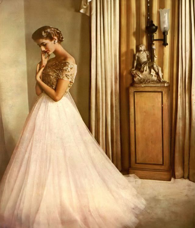 #24 Carmen Dell’ Orefice in delicate, drifting gown of tulle and iridescent embroidery from Elizabeth Arden Fashion Floor, 1951.