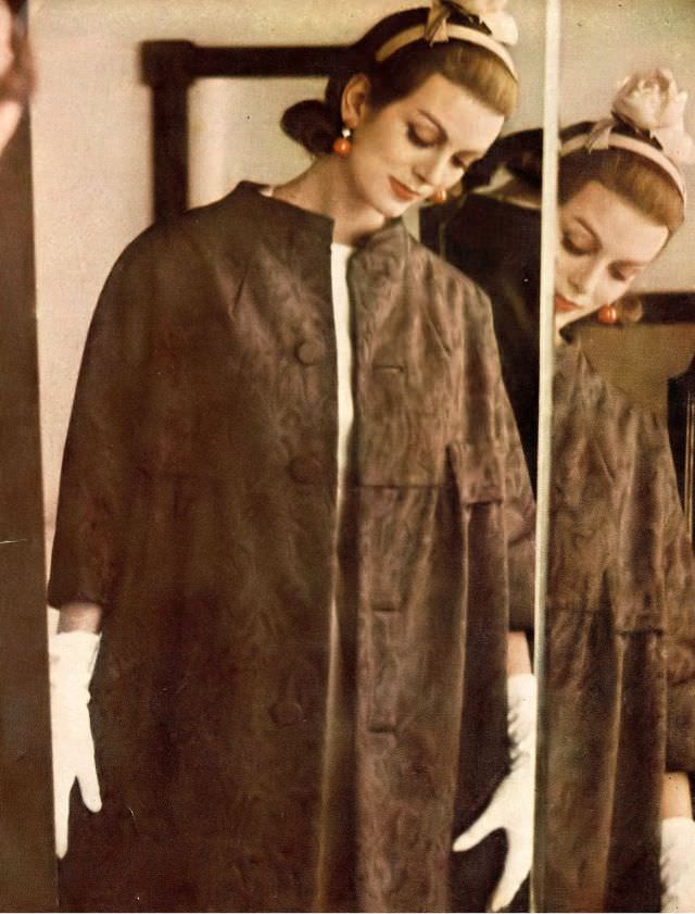 #60 Carmen in brown moiré coat by Arthur Jablow, ecru rose hat by Madcaps, 1959.