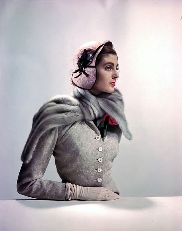 #21 Carmen Dell’ Orefice in dotted wool suit by Jane Derby, mink scarf by Fredrica, hat by Chanda, gloves by Aris, 1949.
