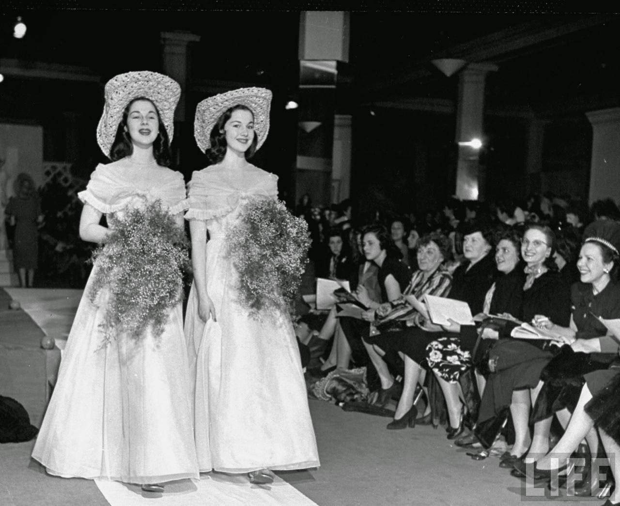 #13 The O’Connor twins Gloria and Consuelo, during fashion show, 1947