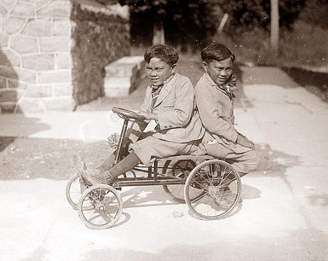 #3 Twin boys on a small pedal car, 1920