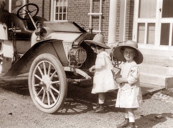 #5 Twin girls getting ready to go in the car, 1914
