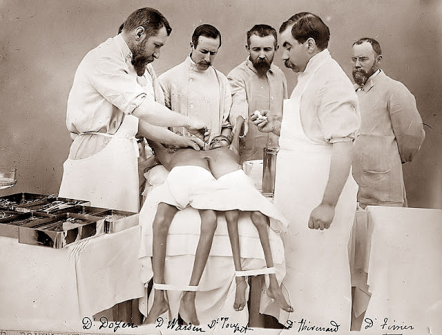 #8 An operating room where doctors are attempting to separate the twins, 1902