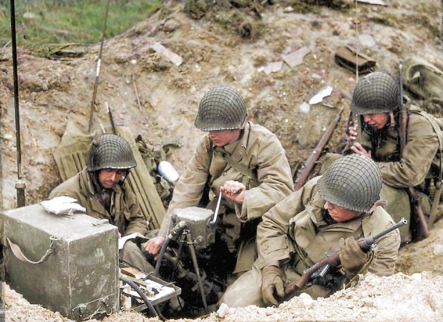 #23 Troops establish a radio communications post after landing.