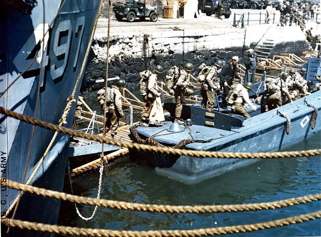 #31 View of American troops as they board an LCVP (Landing Craft, Vehicle, Personnel), Weymouth, England, early June, 1944.