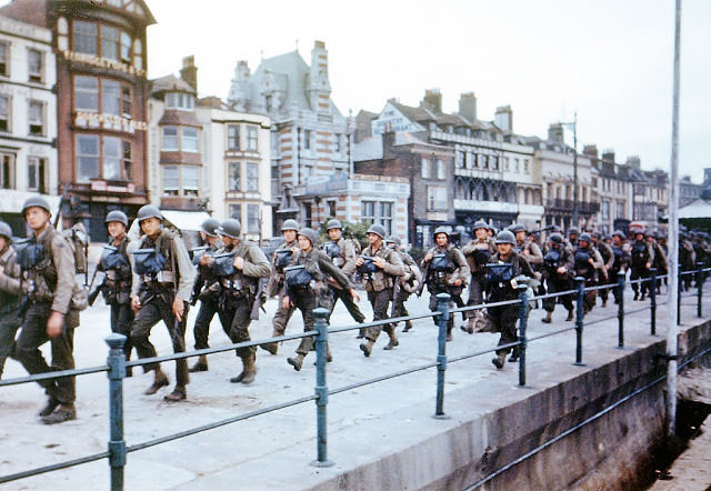 #35 US troops on the Esplanade at Weymouth, Dorset, on their way to embark on ships bound for Omaha Beach for the D-Day landings in Normandy, June 1944.