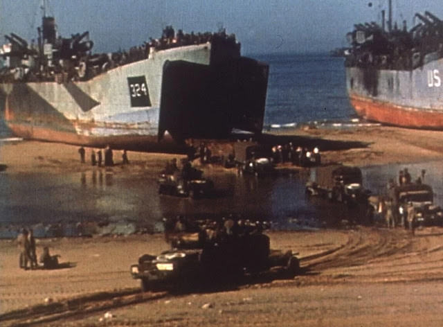 #42 Operation Overlord – On a pebble beach at Omaha Beach U.S. soldiers deal with injuries.