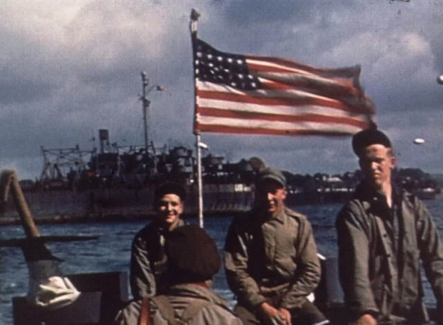 #44 US troops travel the English Channel on a barge en route to Normandy, France for the D-Day Invasion.
