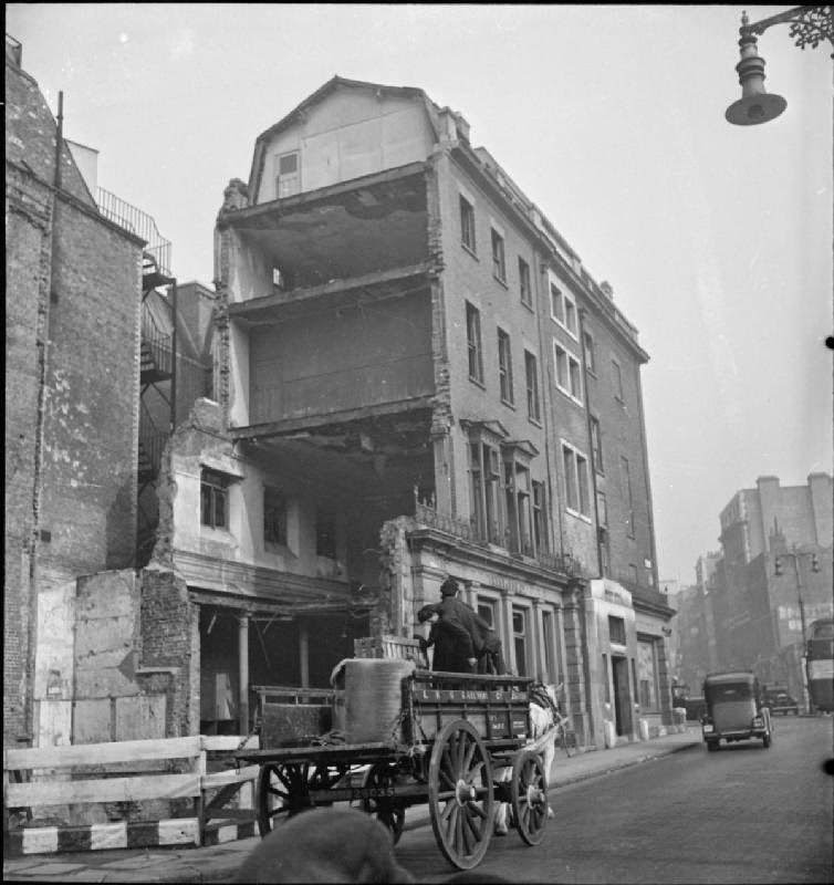 #25 Lilian Carpenter and Vera Perkins drive their horse-drawn cart through London’s West End on the way to their first delivery of the day, 1943.
