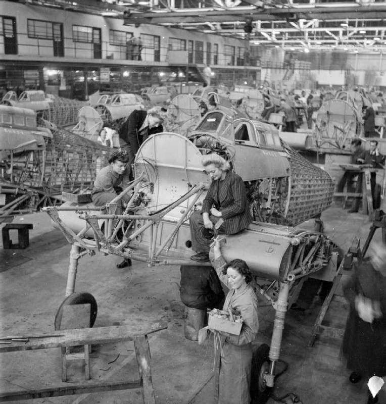 #29 Hawker employees Winnie Bennett, Dolly Bennett, Florence Simpson and a colleague at work on the production of Hurricane fighter aircraft at a factory in Britain, in 1942.