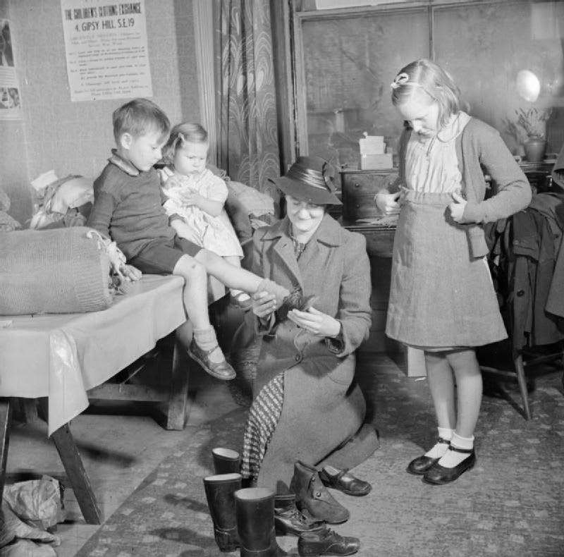#32 Women’s voluntary service run Children’s Clothing Exchange, Norwood, London, 1943.