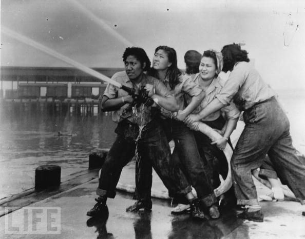 #38 Women are on the front lines of World War II from day one, like these firefighters trying to contain the blaze during the Japanese attack on Pearl Harbor on December 7, 1941.