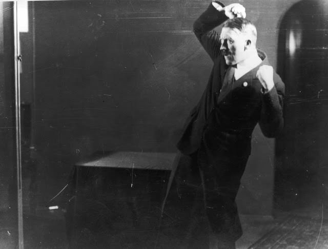 #43 Hitler rehearsing his speech in front of a mirror, 1925