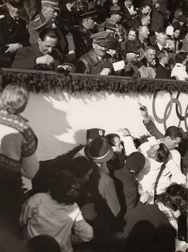 #32 Adolf Hitler and Joseph Goebbels signing autographs at the 1936 Olympics