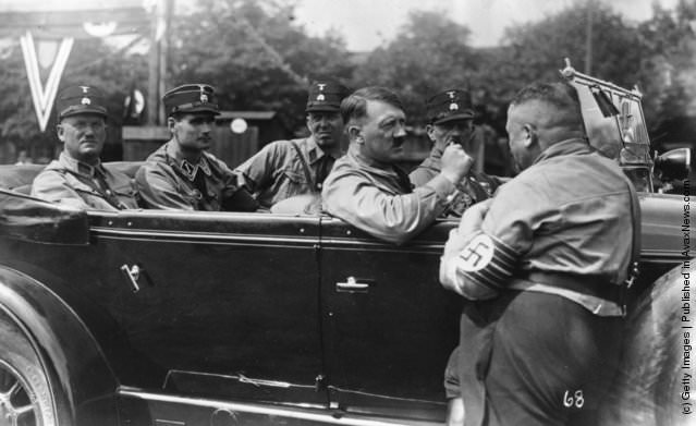 #19 Adolf Hitler with his companions. (Left – Right) Graf, Hess, Schant, Hitler, Sleinbinder and Christian Weber, 1929