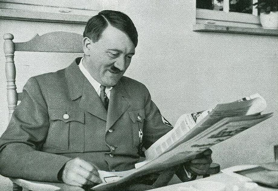#10 Hitler reading a newspaper